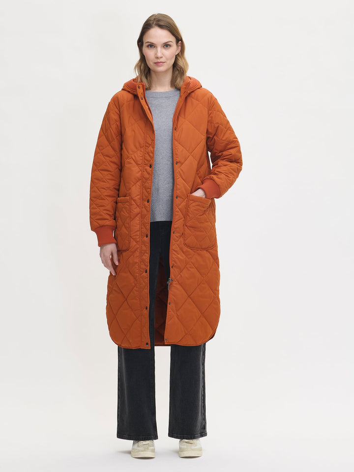 Chelsea | Women’s long quilted hooded coat with oversized patch pockets