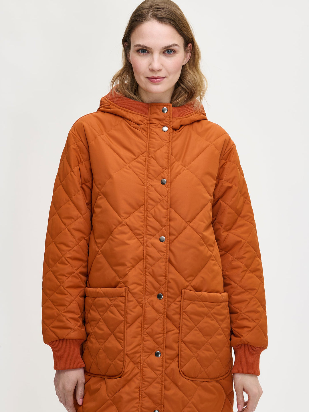 Chelsea | Women’s long quilted hooded coat with oversized patch pockets