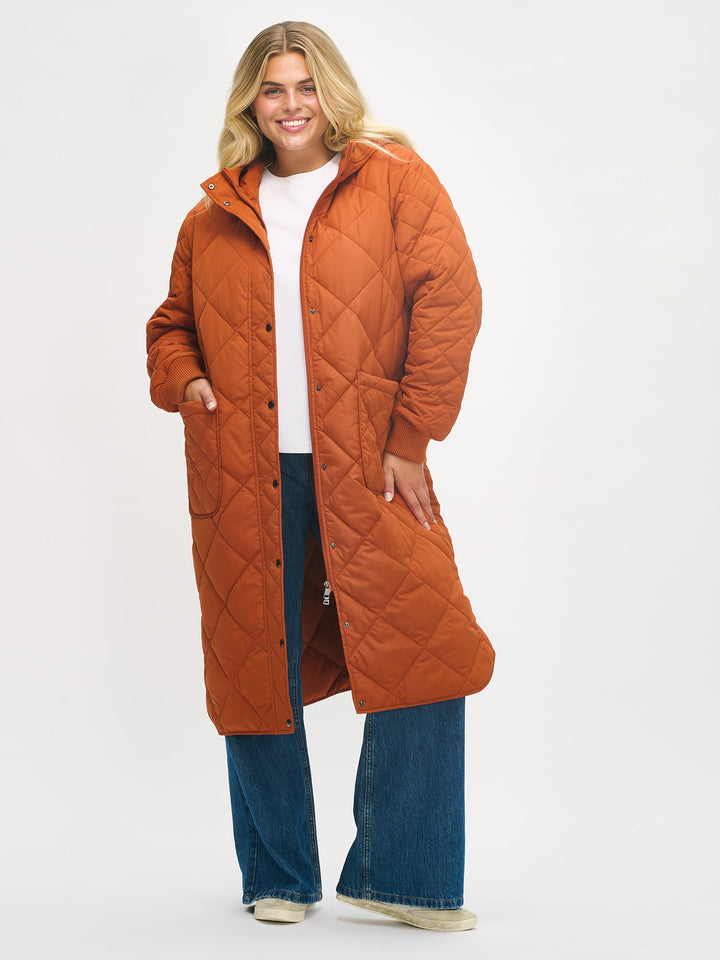 Chelsea | Women’s long quilted hooded coat with oversized patch pockets