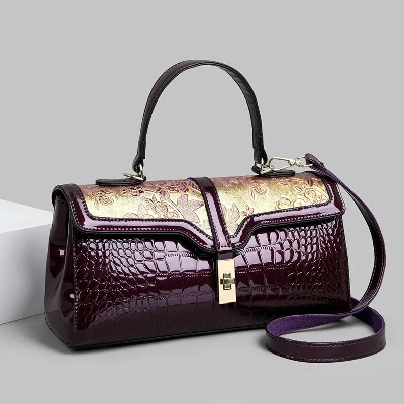 Vera | Women’s patent leather cross body bag with gold hardware