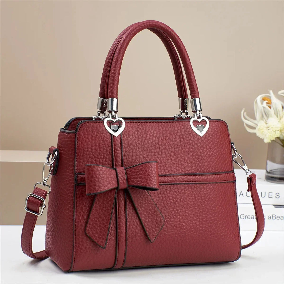 Tamara | Women’s faux leather handbag with bow and heart accents