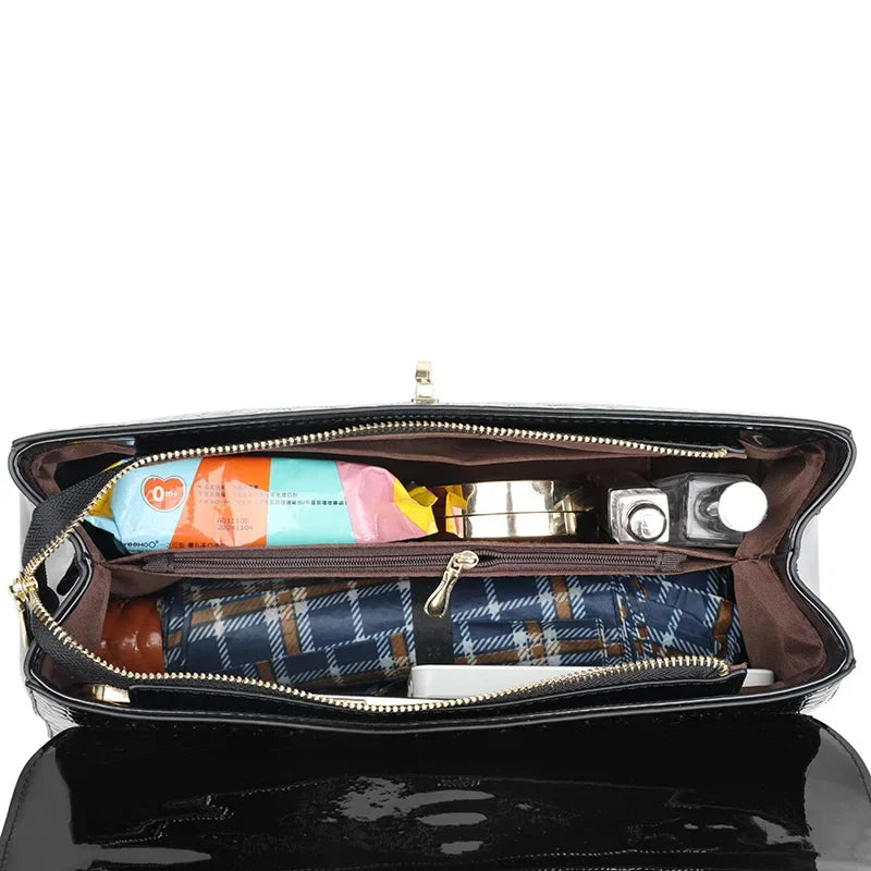 Vera | Women’s patent leather cross body bag with gold hardware