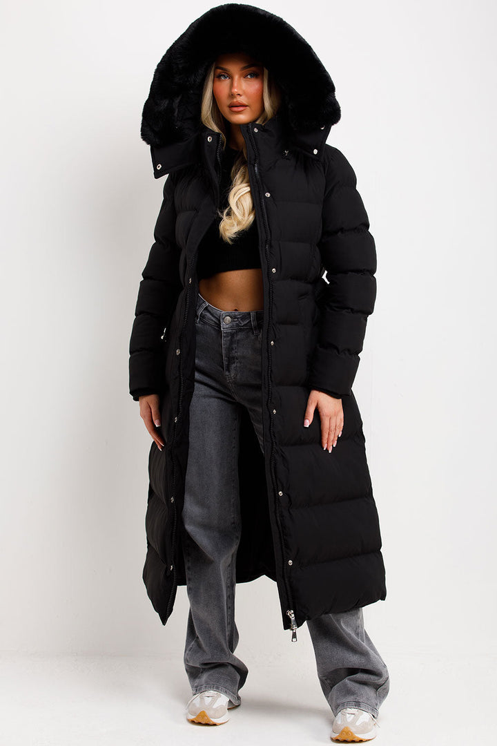 Reeva | Women’s long puffer coat with faux fur hood and belt