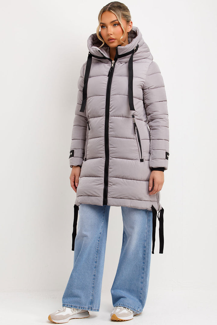 Bailee | Women’s long hooded puffer coat with side strap detail