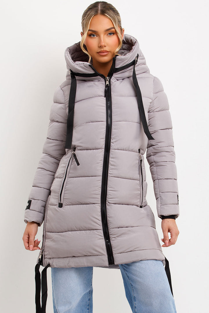 Bailee | Women’s long hooded puffer coat with side strap detail
