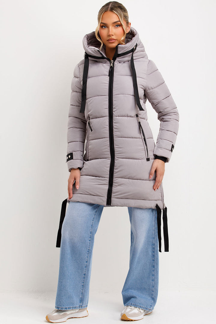 Bailee | Women’s long hooded puffer coat with side strap detail