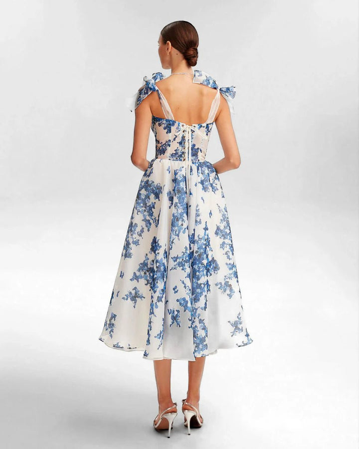 Elana | Romantic midi dress with floral embroidery and bow details
