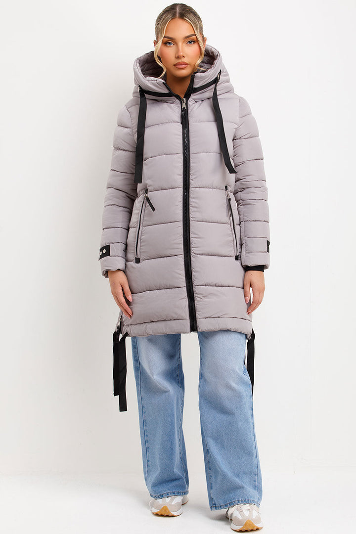Bailee | Women’s long hooded puffer coat with side strap detail