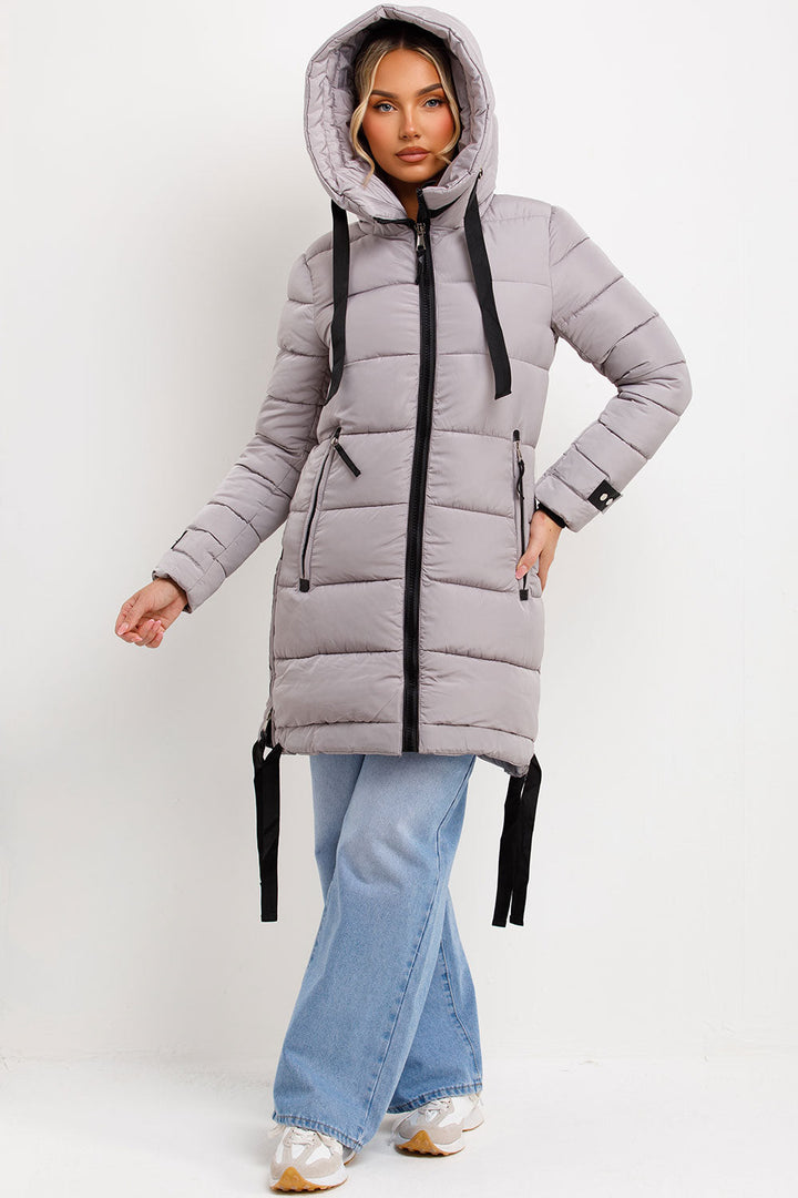 Bailee | Women’s long hooded puffer coat with side strap detail