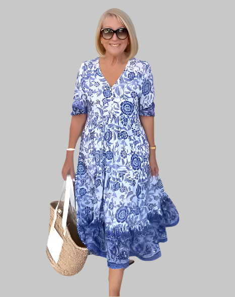 Woman wearing a blue floral dress on a beige background