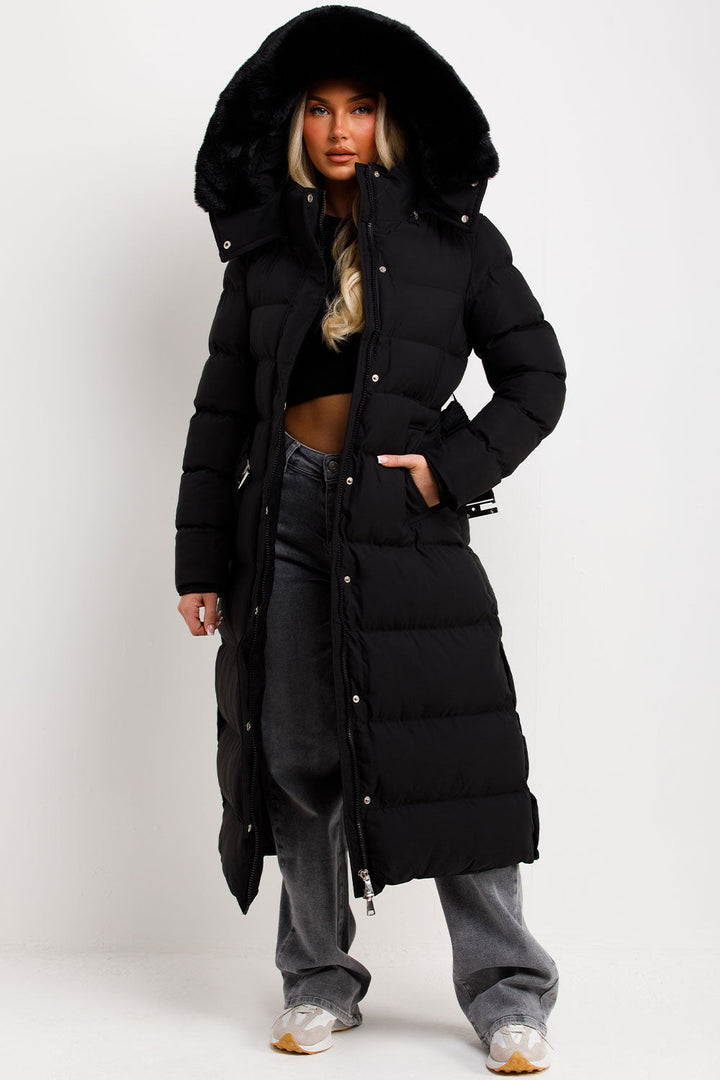 Reeva | Women’s long puffer coat with faux fur hood and belt