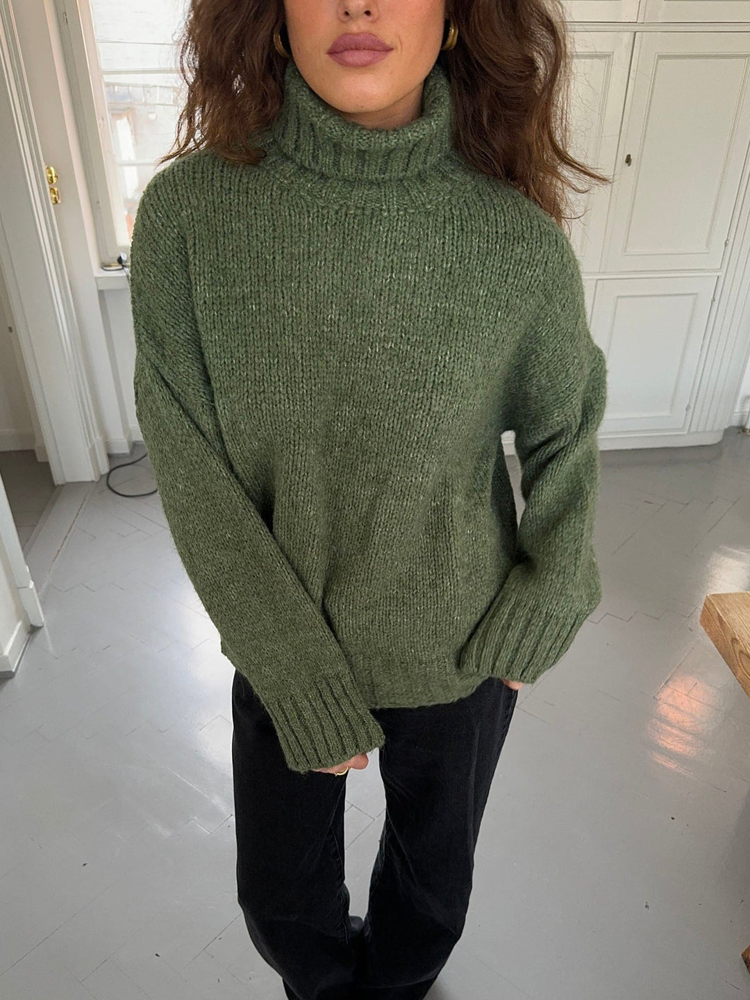 Kris | Women’s green turtleneck sweater with ribbed details and sleek silhouette
