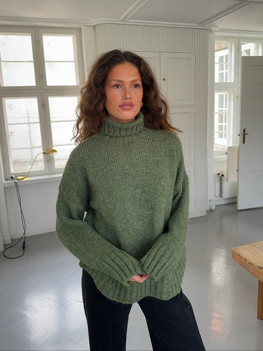 Kris | Women’s green turtleneck sweater with ribbed details and sleek silhouette