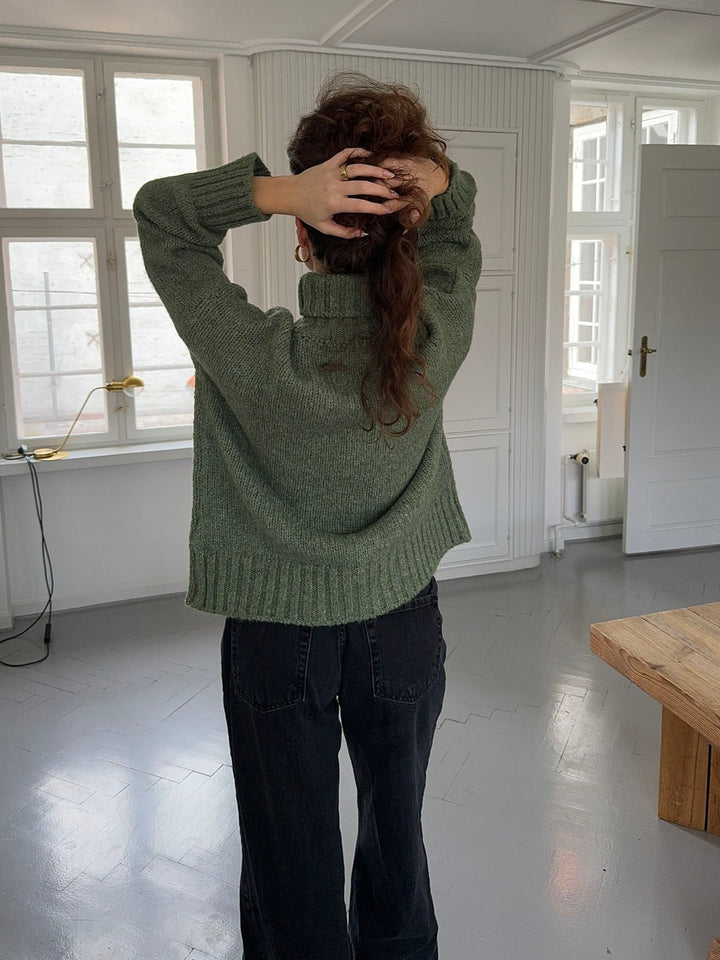 Kris | Women’s green turtleneck sweater with ribbed details and sleek silhouette