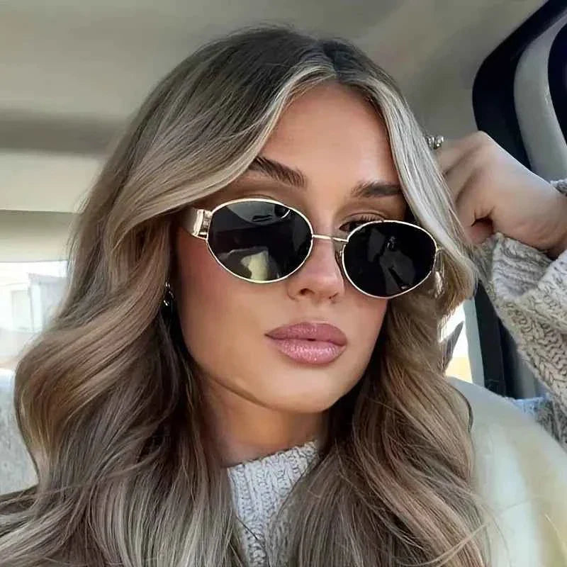 Eliana | Women's oval sunglasses with gold metal frame and dark lenses