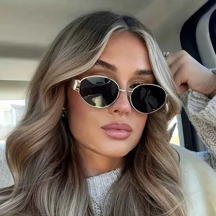 Eliana | Women's oval sunglasses with gold metal frame and dark lenses